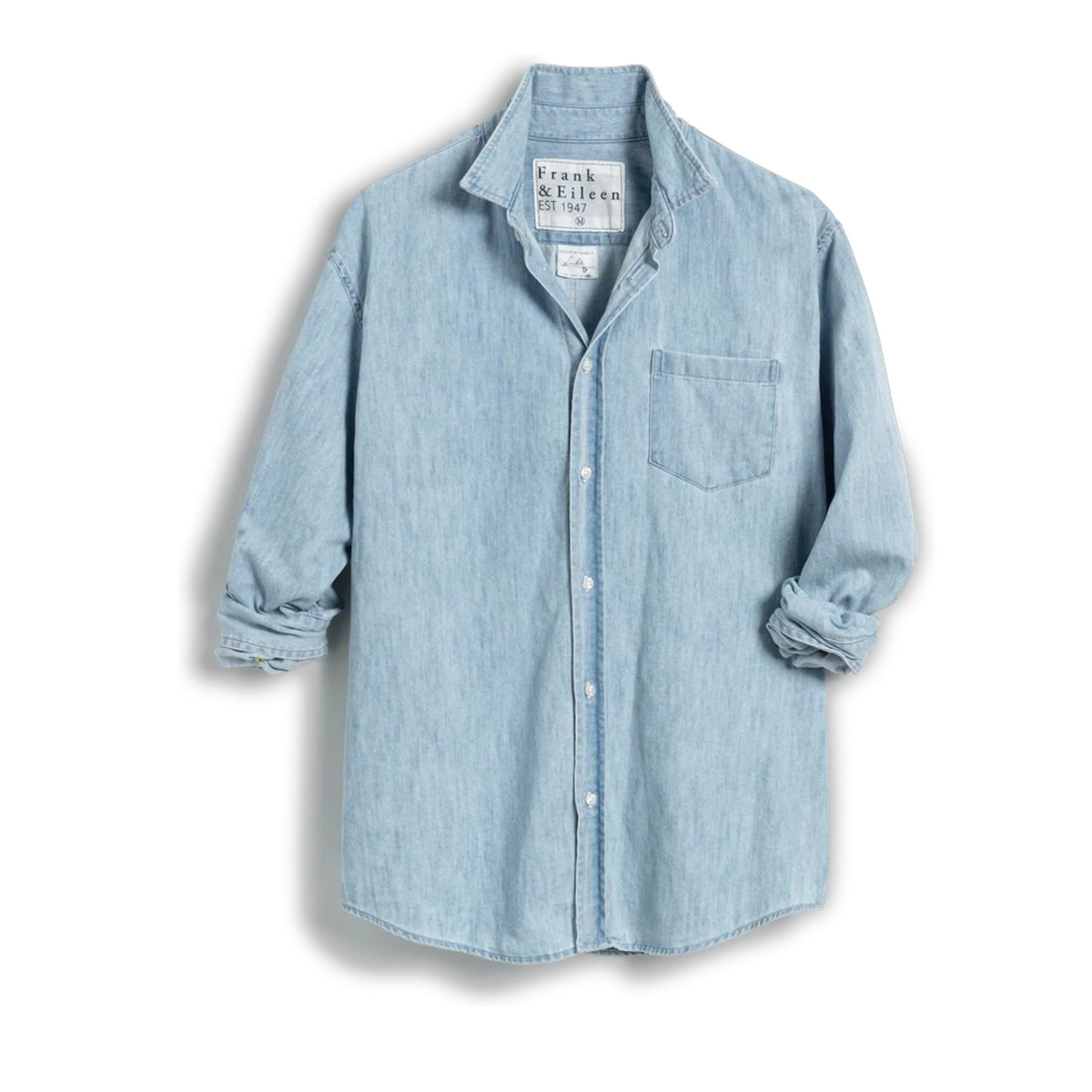 The FRANK &amp; EILEEN LUKE Men&#39;s Button Up Shirt in Famous Denim Classic Wash features light blue 100% cotton denim, a loose fit, straight hem, and rolled long sleeves. Displayed from the back against a white background.