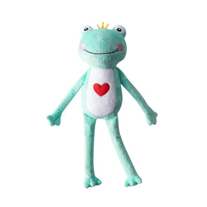 The PET SHOP BY FRINGE STUDIO's PRINCE CHARMING DOG TOY is a plush frog with a yellow crown, white belly, red heart on its chest, long limbs, and a smiling face. It includes crazy crinkle paper for extra fun.