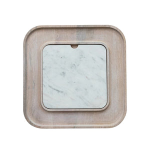 The MANGO WOOD SERVING BOARD WITH MARBLE INSERT by CREATIVE COOP exudes rustic elegance, featuring an assortment of crackers, cheese slices, salami, green olives, and a rosemary sprig neatly displayed on the white marble slab.