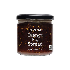 A glass jar of DIVINA - ORANGE & FIG SPREAD by GOURMET FOOD SOLUTIONS, featuring a black lid, is displayed. The label indicates a net weight of 9 ounces (255 grams). Reminiscent of traditional fig jam, this product is certified non-GMO and vegan, as indicated by the icons on the bottom right of the label.