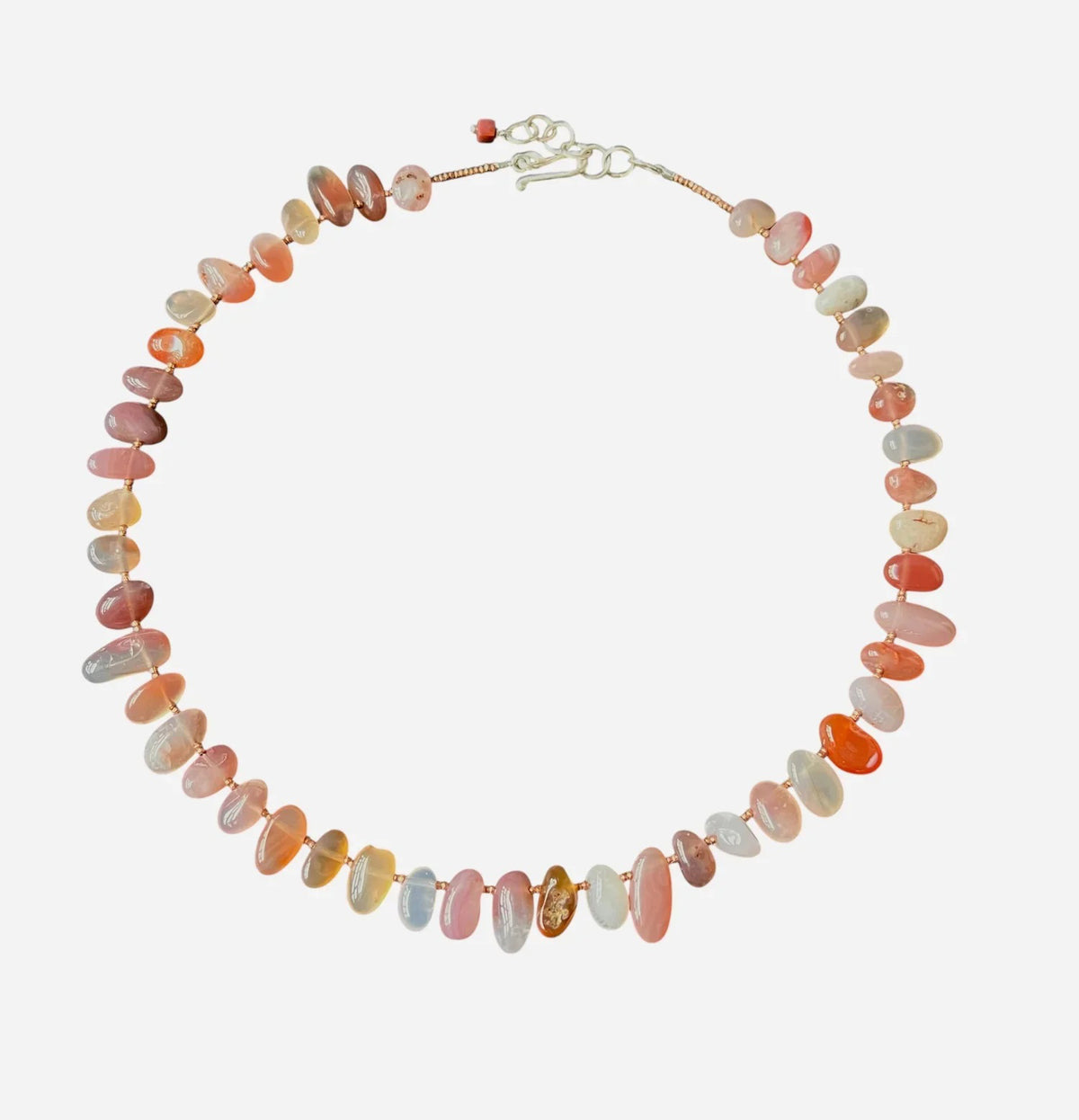 The ANN LIGHTFOOT - Swazi Red Agate Pebble Ras Du Cou Necklace features oval multicolored pink, orange, and light gray stones in a single strand with a sterling silver clasp.