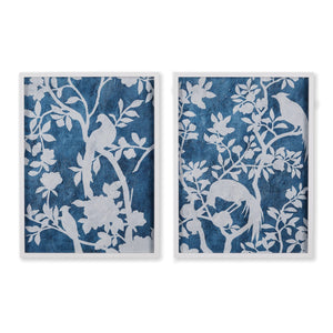 NAPA HOME AND GARDEN's "Aviary Cyano" prints showcase silhouettes of birds on tree branches in a textured blue backdrop, with intricately detailed white leaves and blossoms, offering a serene, nature-inspired aesthetic.