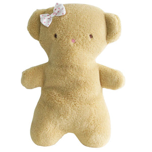 The ALIMROSE - BABY TEDDY RUBY by ALIMROSE is a soft, plush bear with a light tan color. It features a small, pink polka-dotted bow on its head, simple stitching for eyes and nose, and no visible mouth. Its minimalist design gives it a cute and gentle appearance, making it an ideal gift for newborns.