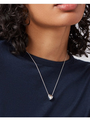 The JENNY BIRD RIO Pendant Necklace features a silver chain with a small triangular pendant and a high-polish finish, set against a plain white backdrop.