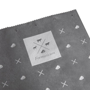 A white box featuring text and illustrations, branded "FORMATICUM" at the top, with three small icons of a goat, cow, and sheep beneath it. The product is identified as "FORMATICUM - REUSABLE CHEESE STORAGE BAGS," designed to maintain freshness. It contains 10 bags and measures 10" x 16" (25 cm x 41 cm).