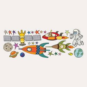 A whimsical space scene featuring colorful rockets, an astronaut, and various planets, stars, and a satellite. The SIMPLE SHAPES - OUTER SPACE REMOVEABLE WALL DECALS by SIMPLE SHAPES showcase fun designs and colors on the rockets, while the astronaut appears to be floating in a spacesuit near Earth and other celestial objects.