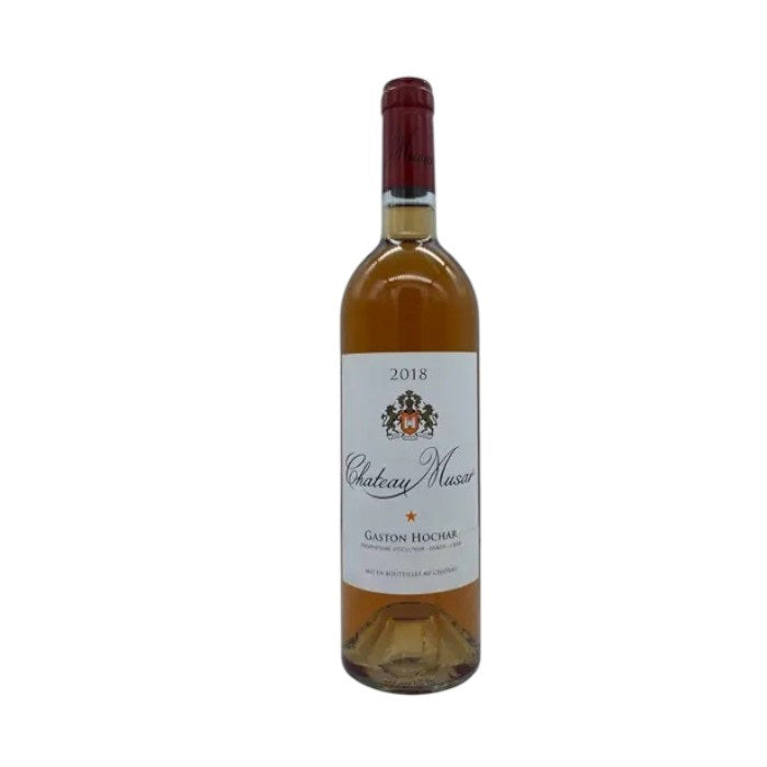 A 2018 Chateau Musar Rosé from the Bekaa Valley, made with Lebanese white grapes, features a crest and red foil top. The label states &quot;Chateau Musar, Gaston Hochar,&quot; emphasizing its Lebanese origin. Brand: Winebow.