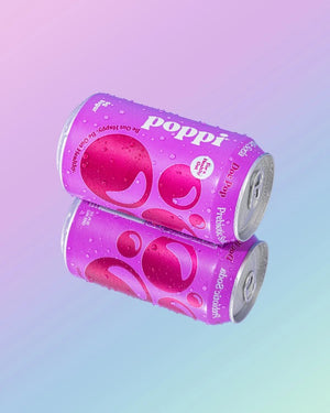 A can of POPPI - DOC POP prebiotic soda is shown. The design features a purple background with abstract bubbles. Infused with apple cider vinegar, this healthy soda promotes digestive health. The text reads, "Poppi," "For a Healthy Gut," and "Be Gut Happy. Be Gut Healthy." The can contains 5g of sugar.