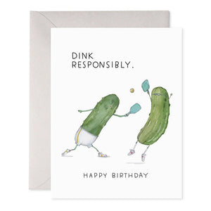 The PICKLEBALL BIRTHDAY CARD by E.FRANCES PAPER is a charming handcrafted birthday card featuring two cartoon pickles engaged in a game of pickleball using paddles and a ball. The delightful watercolor design enhances its appeal, while the text on the card humorously advises, "Dink Responsibly. Happy Birthday." It's an ideal choice for greeting card enthusiasts with a sense of humor!