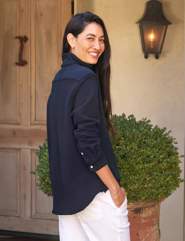 The FRANK &amp; EILEEN Eileen Relaxed Button Up in Triple Fleece British Royal Navy showcases bust-flattering button placement, long rolled-up sleeves, and a chest pocket. Set against a light textured background, it offers classic style and ultimate comfort.