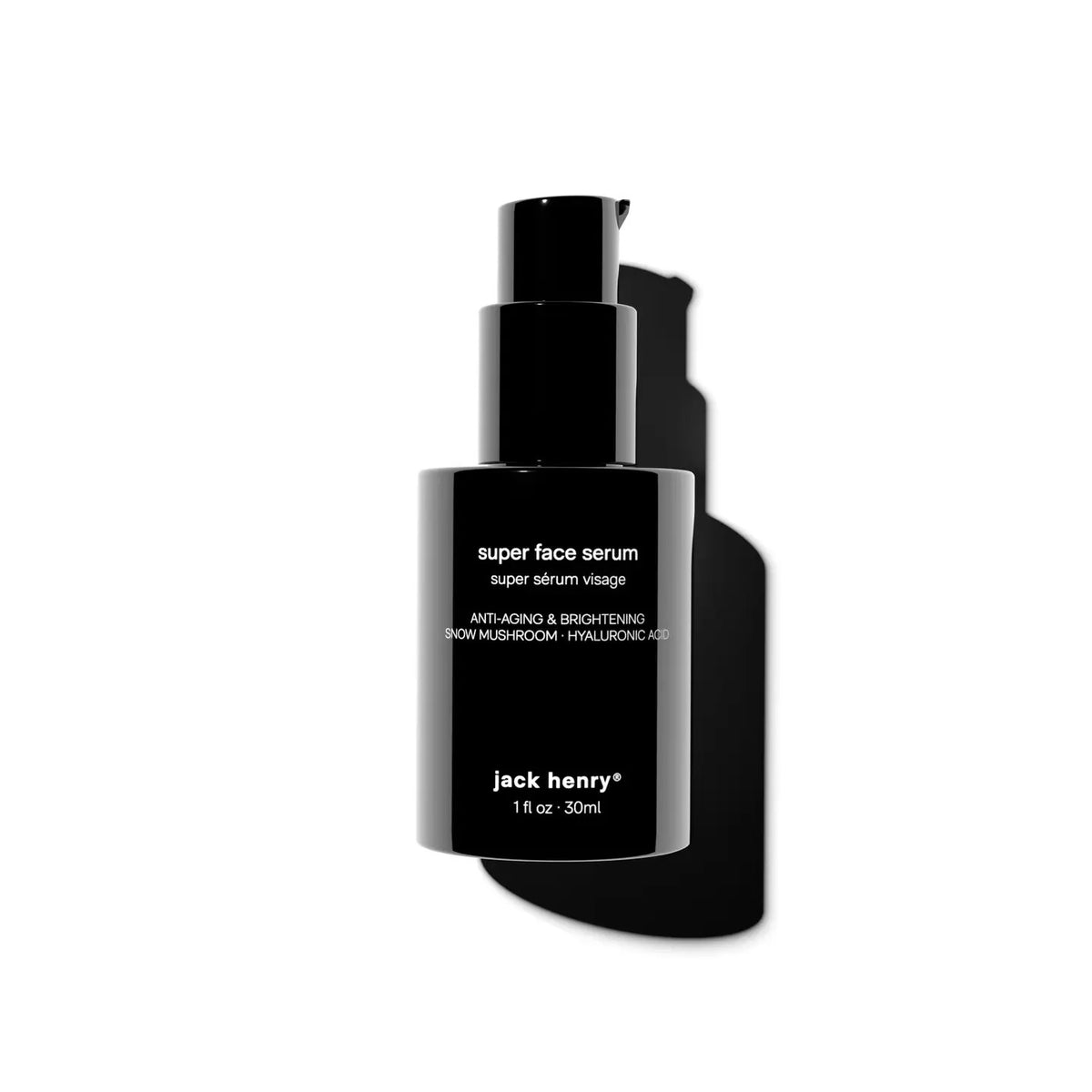 A person with medium-brown skin dispenses JACK HENRY - SUPER FACE SERUM from a black bottle. Overlay text lists orange stem cells, snow mushroom, neroli hydrosol, and hyaluronic acid—each shown with images and benefits.