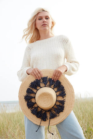 A beautiful MAR Y SOL - PALOMA SUN HAT, featuring a wide brim and colorful tassels around the crown that highlight exquisite artisan craftsmanship, set against a white background.