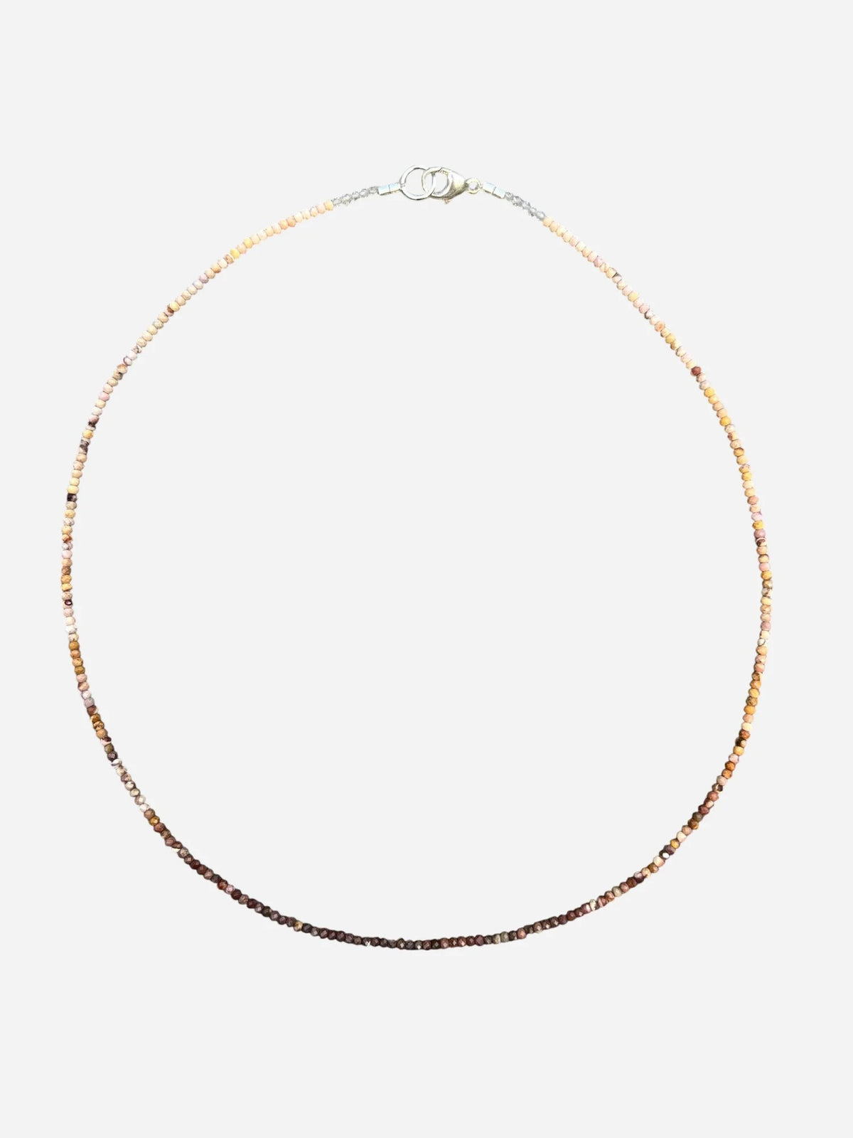 The ANN LIGHTFOOT - Mookite Ombre Ras du Cou Necklace features small, round brown and pink beads with a sterling silver clasp, shown in a circular shape on a white background.
