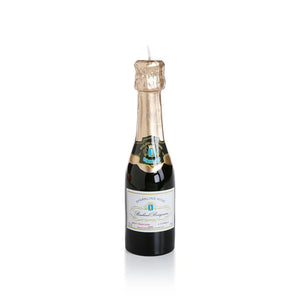 The MINI CHAMPAGNE BOTTLE CANDLE by ZODAX is designed to look just like a bottle of sparkling wine, featuring a dark green body, gold foil wrap, and intricate label. It has accurate dimensions with a wick that emerges from the top, closely resembling a champagne bottle while providing an impressive burn time.