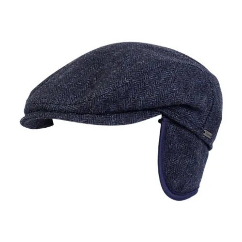 The WIGENS IVY SLIMP HERRINGBONE CAP is a dark gray Shetland wool flat cap with ear flaps, shown in side view on a white background.