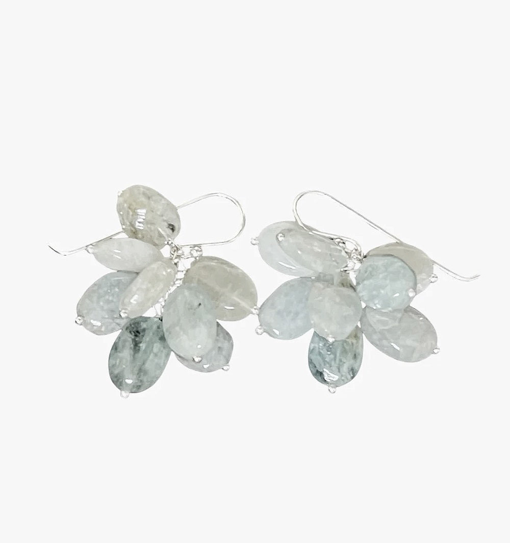 ANN LIGHTFOOT BLUE OPAL CHARM EARRINGS feature sterling silver hooks and clusters of faceted, teardrop gemstones in ombre blue, gray, and clear shades, artfully arranged like delicate petals or leaves.