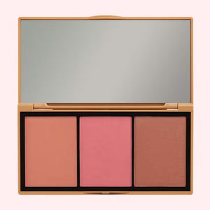 Two makeup palettes, each a JASON WU - BLUSH TRIO from JASON WU BEAUTY, are displayed with three glowing colors. The left blush palette features orange, peach, and pink tones, while the right includes pink, mauve, and rose shades. Swatches of the colors are blended below each corresponding palette.