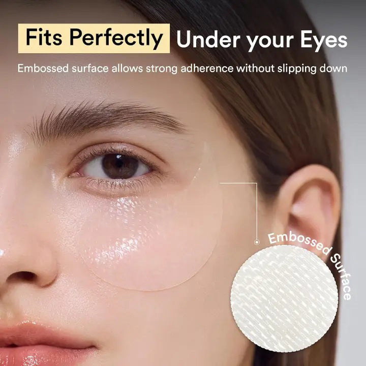 A white jar labeled &quot;ABIB - COLLAGEN EYE PATCH JERICHO ROSE JELLY 60 PCS&quot; from ASIAN BEAUTY WHOLESALE with a translucent eye patch being lifted—ideal for under-eye bags—sits beside a small green plant.