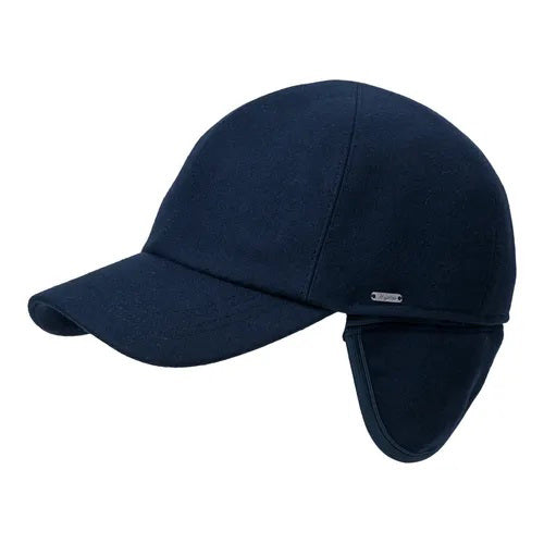 The WIGENS - CLASSIC WOOL BASEBALL CAP by WIGENS is a navy blue winter cap with quilted polyester lining and fold-down earflaps, designed to keep your ears warm and protected in cold weather.