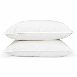 Two white, fluffy FEARRINGTON LIFESTYLE BEDDING COLLECTION - STANDARD FEATHER PILLOWS from the brand DOWNLITE are neatly stacked on top of each other against a plain white background. The down outer chamber and feather core make the pillows appear soft and inviting, featuring a clean, minimally wrinkled surface.