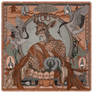 The SABINA SAVAGE - THE SONG DEER SILK TWILL SCARF 135CM by SABINA SAVAGE ENGLAND features intricate designs in shades of brown, beige, and green. This elegant silk twill scarf showcases a mix of patterns including polka dots, wings, a ship with a flag, and various geometric shapes. Inspired by Tibetan thangkas, the edges are decoratively fringed for an added touch of sophistication.