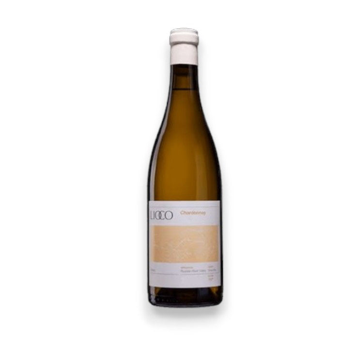 The LIOCO ESTERO CHARDONNAY 2021 by WINE: PROOF features a long-neck bottle with a cork top. Its white label presents a minimalist design, accented by a pale yellow rectangle with &quot;Chardonnay&quot; elegantly printed, offering lemon curd and chamomile notes from Russian River Valley.