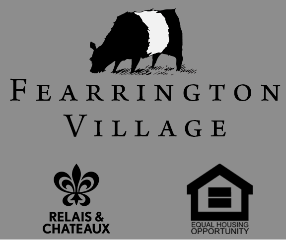 Black and white logo for Fearrington Village featuring a silhouette of a beltie cow above the village name, with Relais & Chateaux and Equal Housing Opportunity logos underneath.