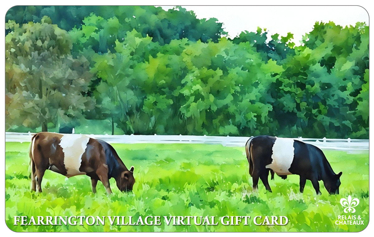 Two brown and white cows graze in a green field with trees and a white fence in the background. Text at the bottom reads "Fearrington Village Virtual Gift Card." Relais & Chateaux logo appears in the lower right corner.