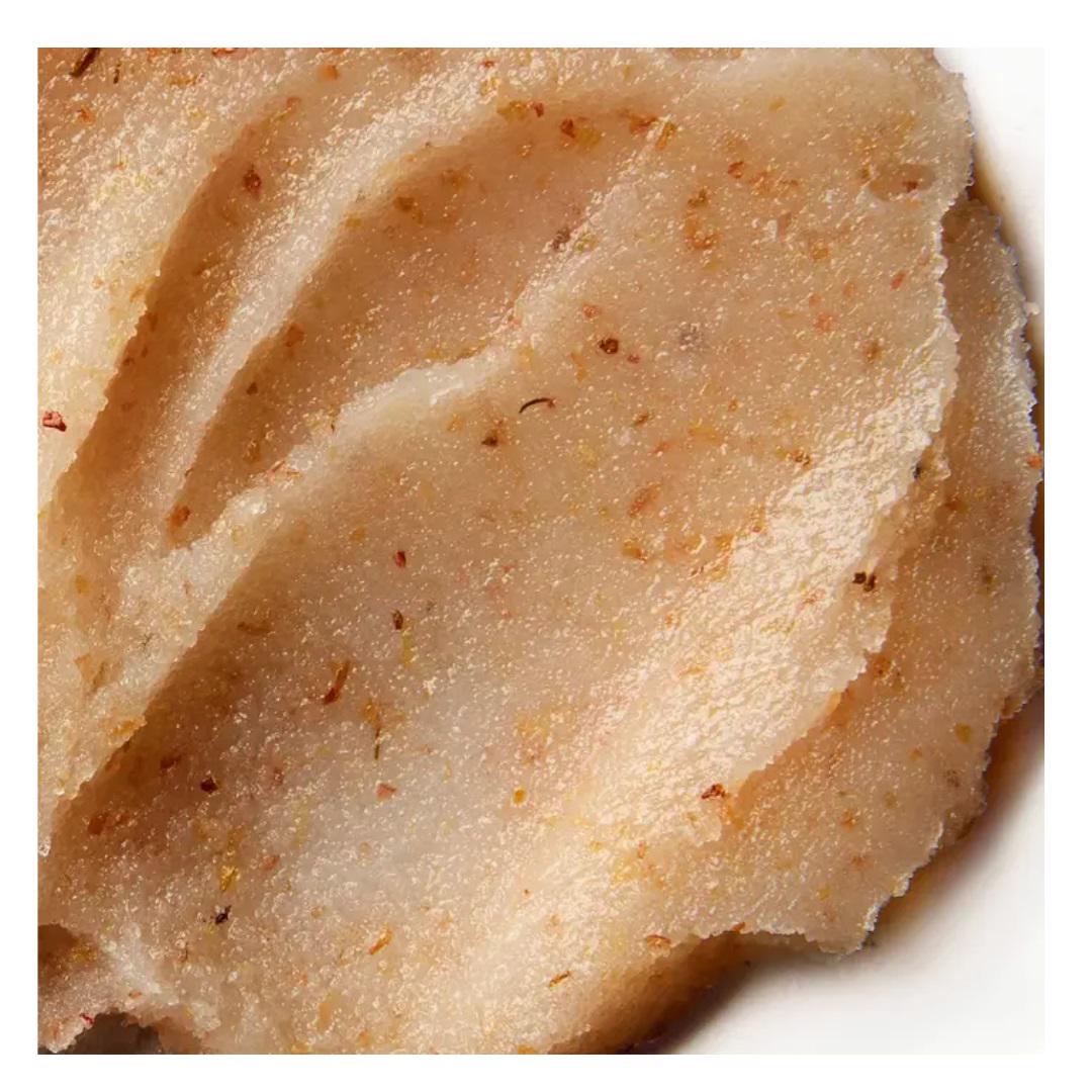 A red glass jar with a clasp lid is labeled &quot;ELEMIS - EXOTIC LIME &amp; GINGER SALT GLOW&quot; from the brand ELEMIS - STEINER. The text indicates it weighs 490 grams or 17 US ounces. This salt scrub exfoliates and moisturizes the skin, and the jar is displayed against a white background.