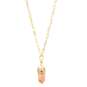 A mannequin bust displays a stunning GAS BIJOUX Aventura Pendant Necklace, featuring a rectangular pink gemstone pendant capped with metal and adorned with a small rock crystal stone. This elegant and minimalistic design beautifully emphasizes the gemstone.