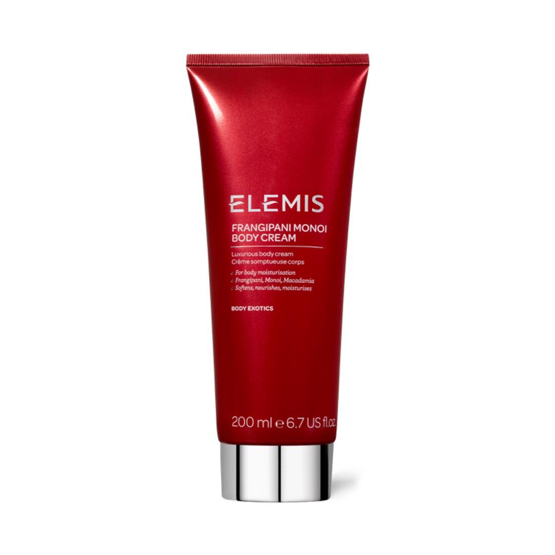 A red cylindrical tube with a silver cap labeled &quot;ELEMIS - FRANGIPANI MONOI BODY CREAM&quot; by ELEMIS - STEINER. The text on the tube highlights it as a luxurious, deeply hydrating body cream formulated with nourishing essential oils and Frangipani Flowers. It hydrates, nourishes, and softens, with a 200 ml (6.7 US fl oz) capacity.