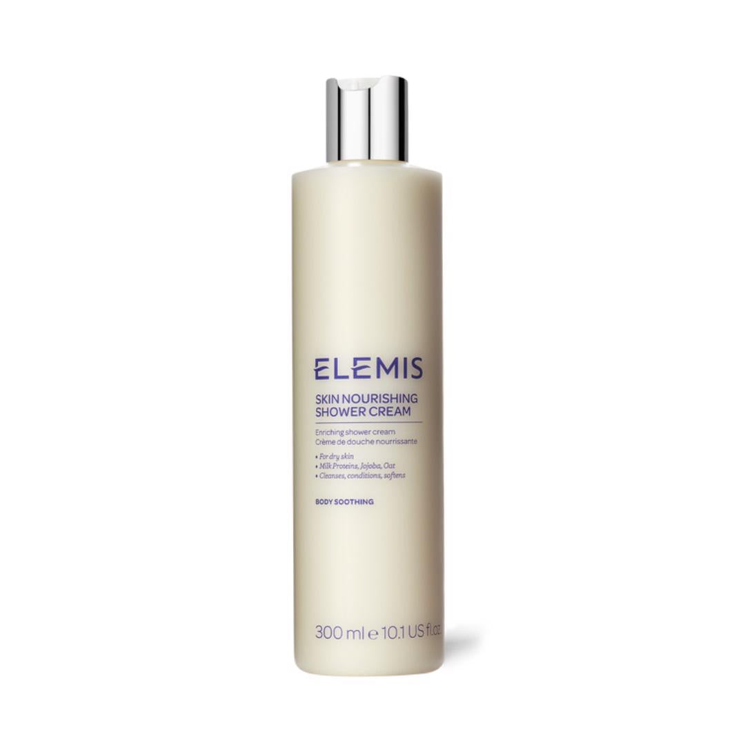 A 300ml bottle of ELEMIS - SKIN NOURISHING SHOWER CREAM by ELEMIS - STEINER. The off-white bottle with a silver cap and blue text features an enriching formula designed to soothe and moisturize the skin.