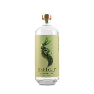 A clear glass bottle of SEEDLIP - GARDEN 108 NON ALCOHOLIC SPIRIT from SEEDLIP DRINKS against a white background. The bottle features a green label with an artistic illustration of peas and leaves forming a surreal face. It is crafted from botanical distillates and topped with a wooden cork adorned with a green ribbon.