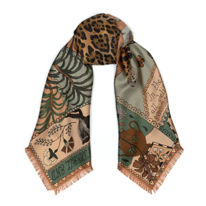 The SABINA SAVAGE ENGLAND - THE JAGUAR'S PARADISE SILK TWILL 135CM scarf showcases an array of nature-inspired illustrations and patterns. It features a stunning mix of animal prints, including a detailed leopard pattern, alongside exquisite botanical designs. Highlighting endangered species, the scarf boasts a beige and green color scheme with intricate details reminiscent of an antique embroidery sampler.