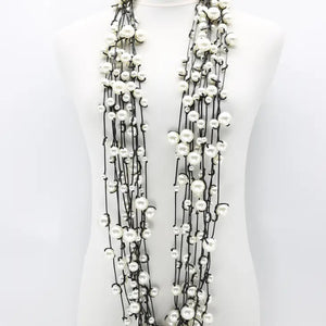 FAUX PEARLS ON LEATHERETTE 10 STRANDS