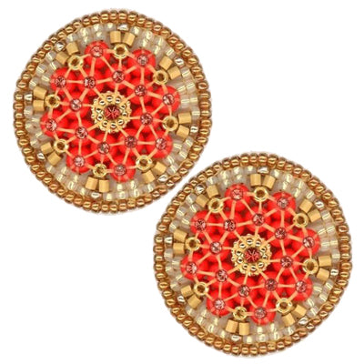 A circular decorative brooch from the Miguel Ases Collection showcases intricate beadwork in a stunning radial pattern. At its center is a gold design, encircled by red beads and bordered by alternating gold and beige beads. The entire piece, set against a plain white background, exudes the same elegance found in MIGUEL ASES - SWAROVSKI MIYUKI RONDELLE EARRINGS by MIGUEL ASES, INC.