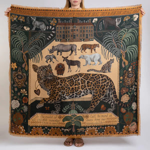 The SABINA SAVAGE ENGLAND - THE JAGUAR'S PARADISE SILK TWILL 135CM scarf showcases an array of nature-inspired illustrations and patterns. It features a stunning mix of animal prints, including a detailed leopard pattern, alongside exquisite botanical designs. Highlighting endangered species, the scarf boasts a beige and green color scheme with intricate details reminiscent of an antique embroidery sampler.