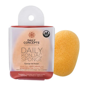 A package of DAILY CONCEPTS KONJAC SPONGE - TURMERIC is shown. The light yellow sponge, crafted from 100% natural Konjac root infused with turmeric to hydrate and regenerate skin, is both biodegradable and vegan. The white and orange packaging highlights these benefits.