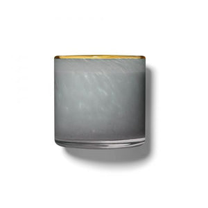 The LAFCO - SEA DUNE, BEACH HOUSE 6.5oz votive candle holder is displayed against a plain white background. Featuring a clear cylindrical design with a white inner surface, this sleek and minimalistic piece evokes the tranquil decor of a beach house, casting a subtle shadow to the right.