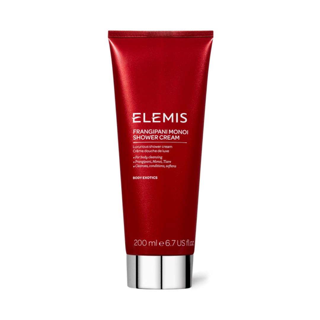 A red tube of ELEMIS - FRANGIPANI MONOI SHOWER CREAM by ELEMIS - STEINER. The text on the tube highlights that it is a luxurious, skin-softening shower cream designed to cleanse, soften, and purify the skin with Tahitian Monoi Oil and Frangipani Flowers. The tube has a volume of 200 ml or 6.7 US fl oz.